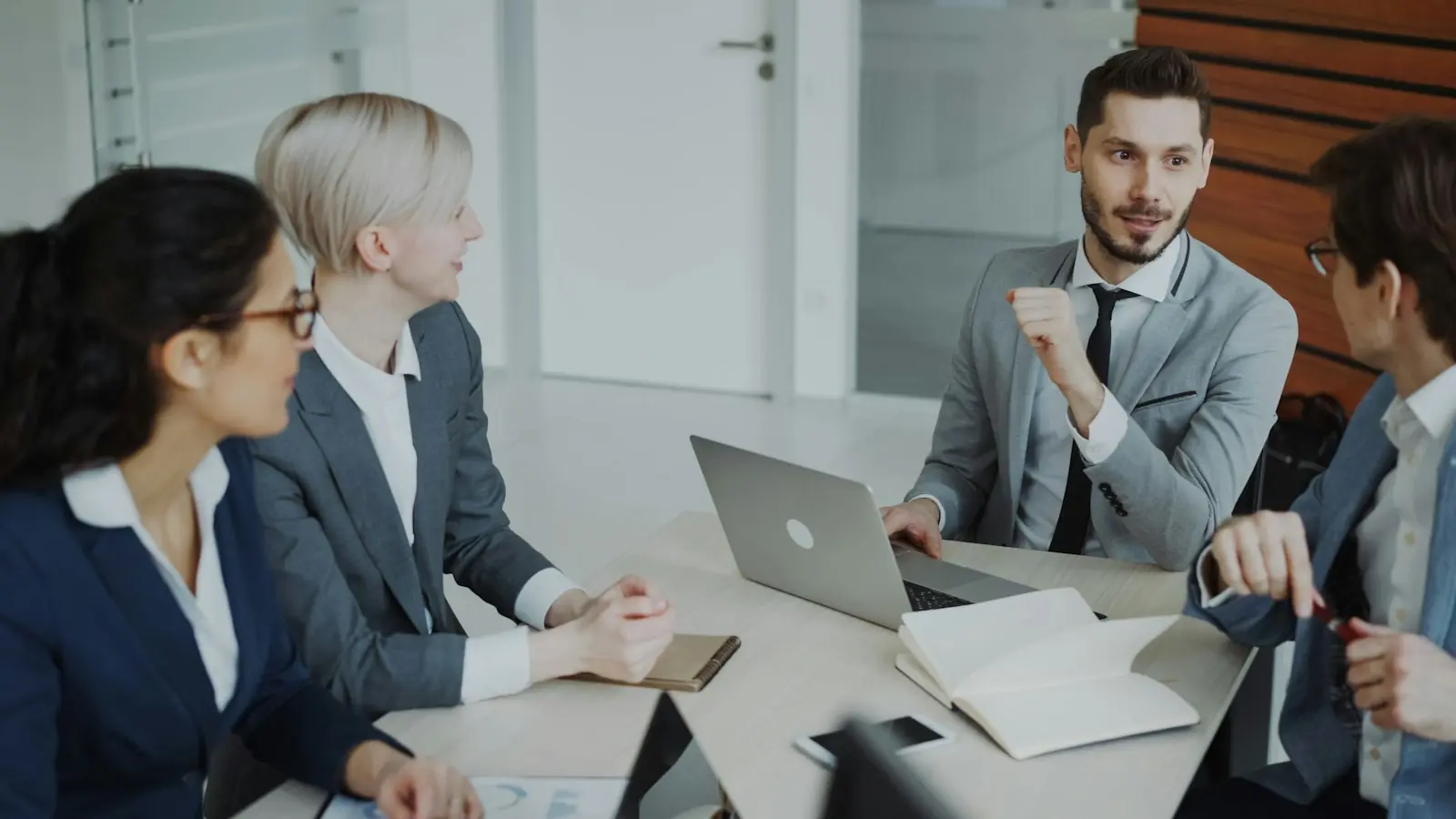 Consultants in a meeting around a table